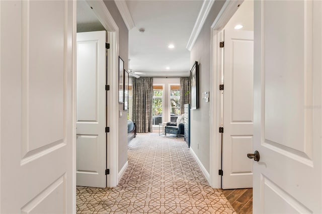 corridor featuring ornamental molding, recessed lighting, and baseboards