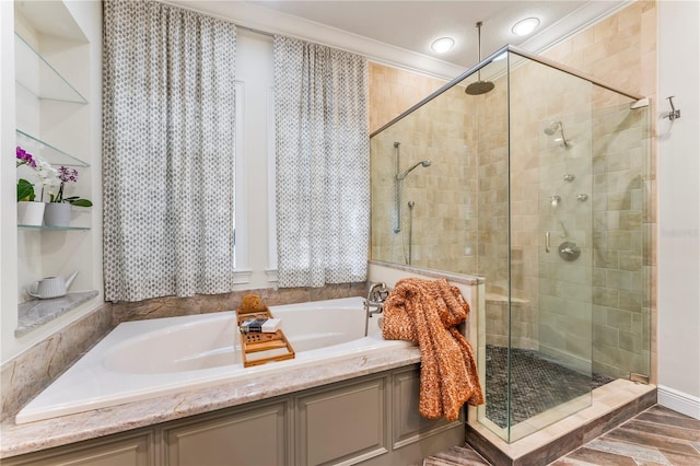 full bath with ornamental molding, a stall shower, and a bath