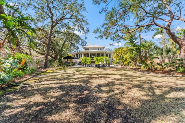 view of yard featuring a patio area and a fenced backyard