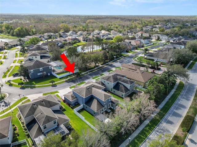 birds eye view of property with a residential view