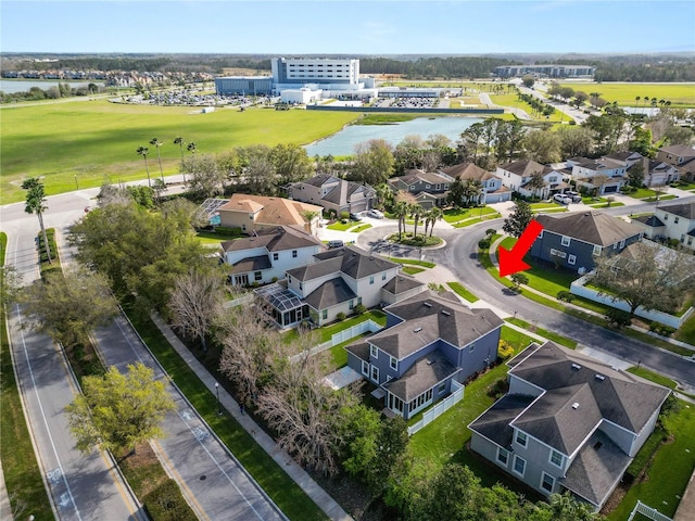 aerial view featuring a water view and a residential view