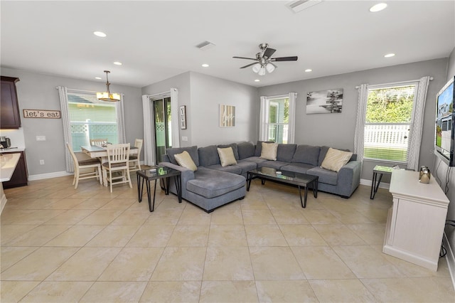 living area with visible vents, a wealth of natural light, and recessed lighting