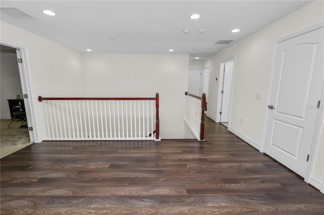 unfurnished room featuring recessed lighting, visible vents, and wood finished floors