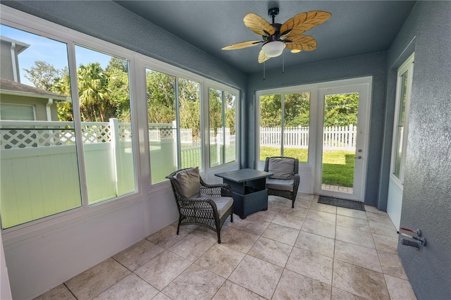 sunroom / solarium with ceiling fan