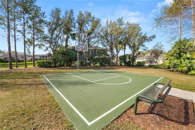 view of sport court featuring a yard and community basketball court