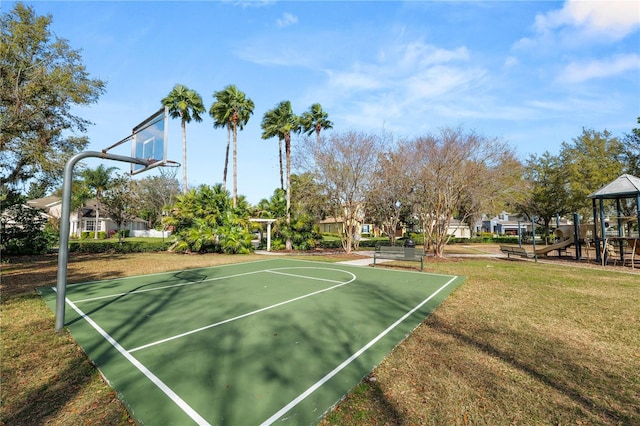 view of basketball court featuring a yard, playground community, and community basketball court