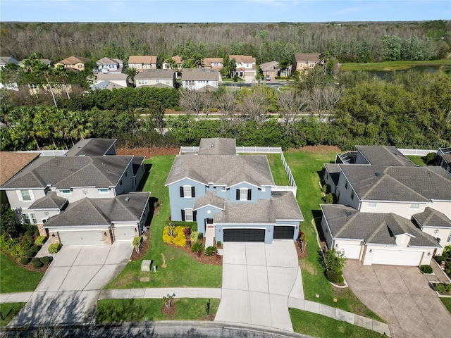 bird's eye view with a forest view and a residential view