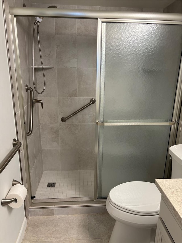 11200 102nd Ave Unit 125, Seminole, FL 33778 - full bathroom with tile patterned floors, toilet, a shower stall, and vanity