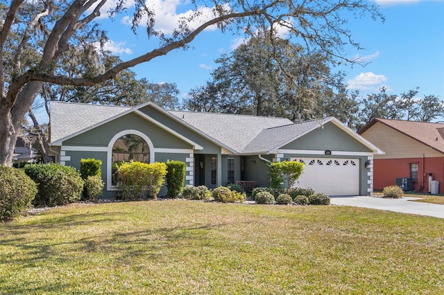 ranch-style home with a garage, cooling unit, and a front lawn