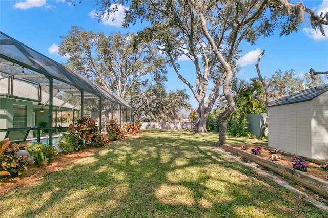 view of yard featuring a fenced in pool and a lanai