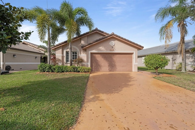 view of front of property featuring a garage and a front yard