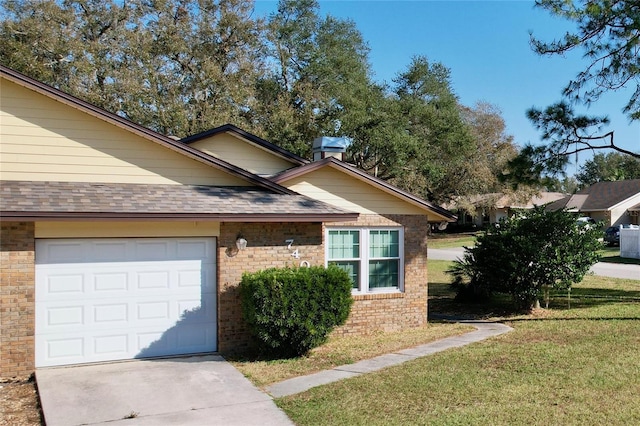 view of front of property with a garage and a front yard