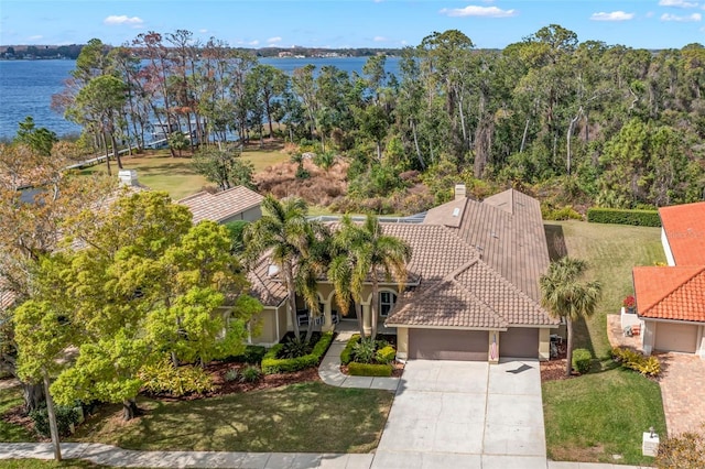 birds eye view of property with a water view