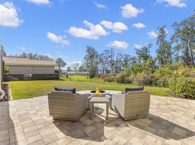 view of patio / terrace with an outdoor living space with a fire pit