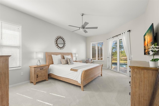 bedroom featuring ceiling fan, vaulted ceiling, light carpet, and access to outside