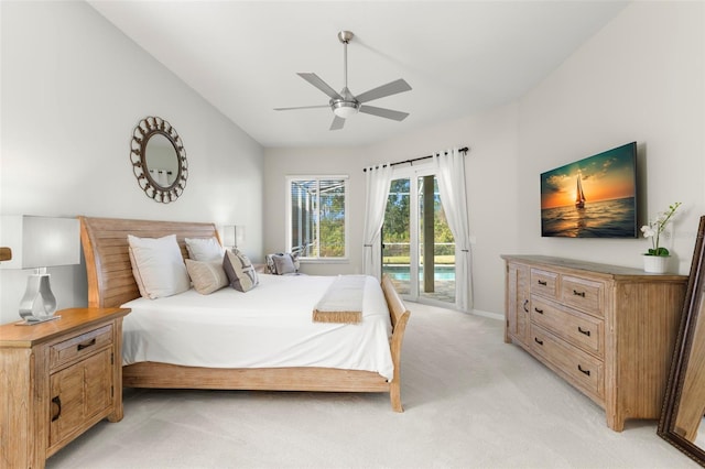 carpeted bedroom with vaulted ceiling, access to exterior, and ceiling fan