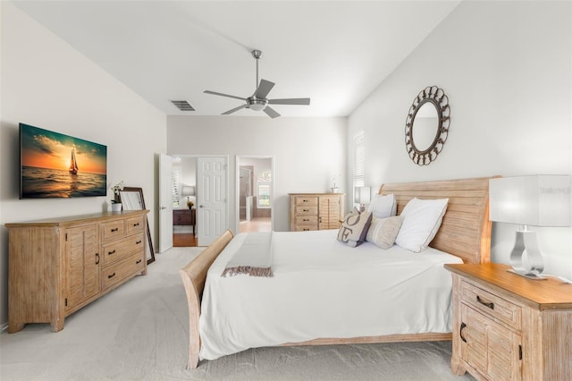 bedroom with light carpet and ceiling fan