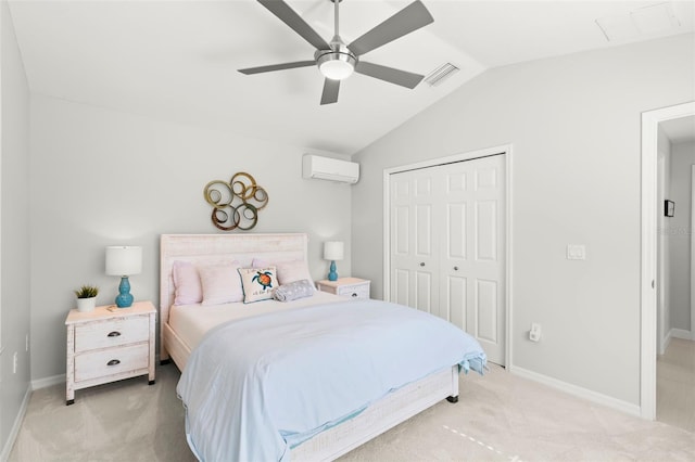 carpeted bedroom featuring lofted ceiling, ceiling fan, a closet, and a wall mounted AC