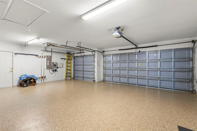 garage featuring a garage door opener and electric panel