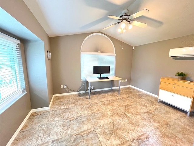 interior space featuring ceiling fan, vaulted ceiling, and a wall mounted AC