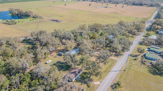 birds eye view of property with a water view and a rural view