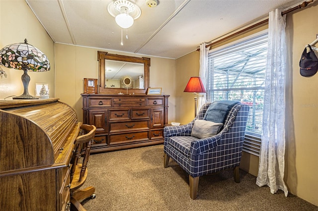 sitting room featuring light colored carpet