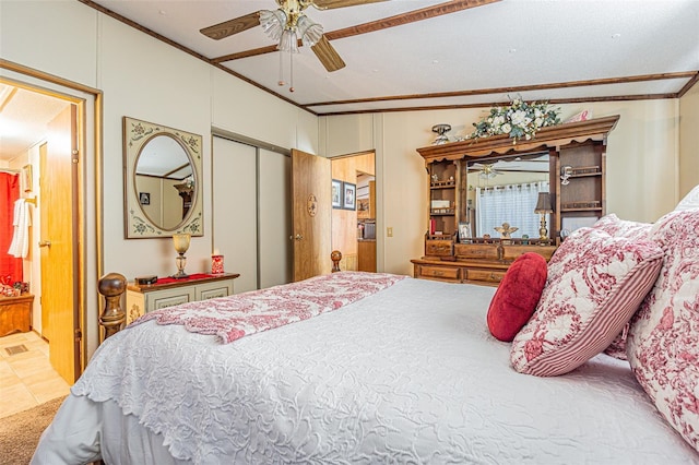 bedroom with crown molding, ensuite bath, and ceiling fan