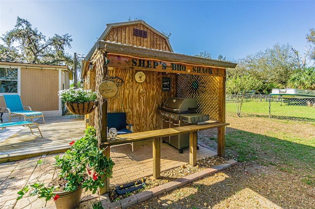 exterior space featuring an outdoor structure and grilling area