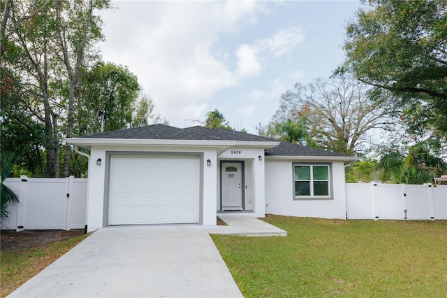 single story home with a garage, driveway, a front yard, and a gate