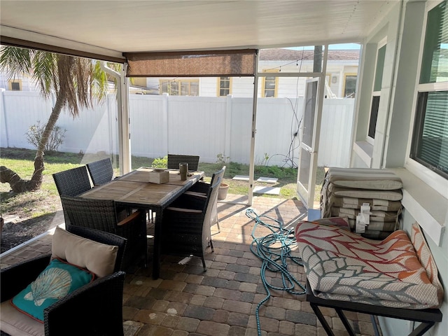 sunroom / solarium featuring plenty of natural light