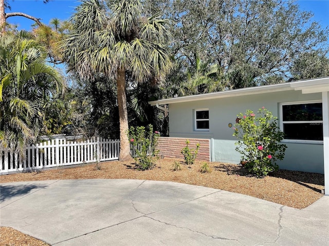 view of side of property featuring a patio area