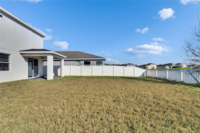 view of yard with a fenced backyard