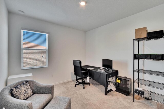 home office with carpet floors and baseboards