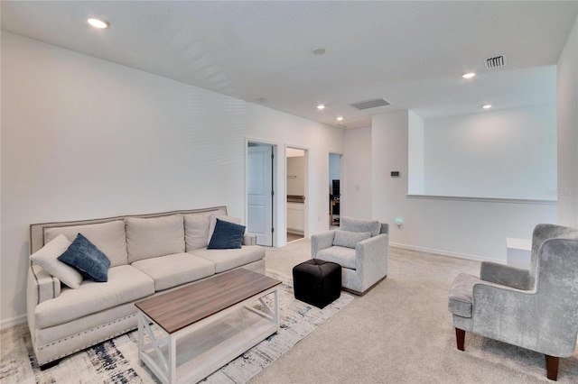 living room featuring carpet, visible vents, baseboards, and recessed lighting