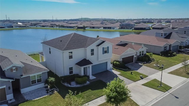 bird's eye view with a water view and a residential view