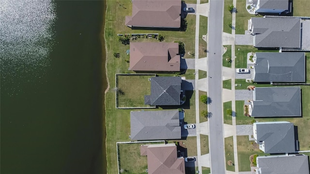 bird's eye view with a residential view and a water view