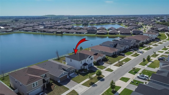 aerial view featuring a water view and a residential view