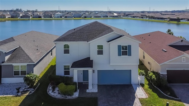 bird's eye view with a water view and a residential view