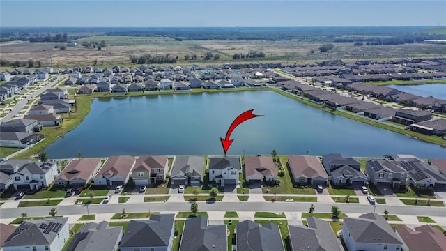 aerial view featuring a water view and a residential view