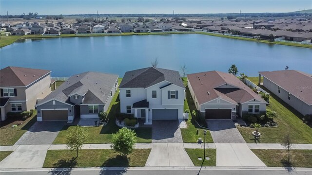 drone / aerial view with a water view and a residential view