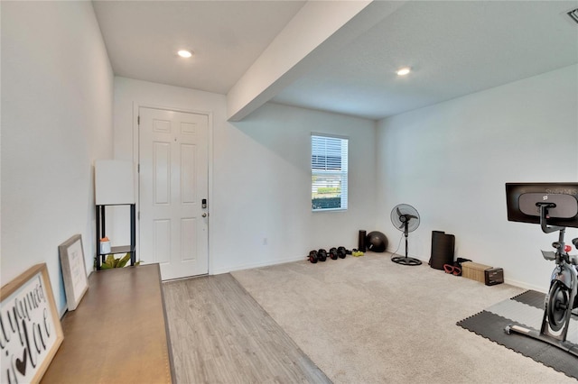 workout room featuring recessed lighting, visible vents, baseboards, and wood finished floors