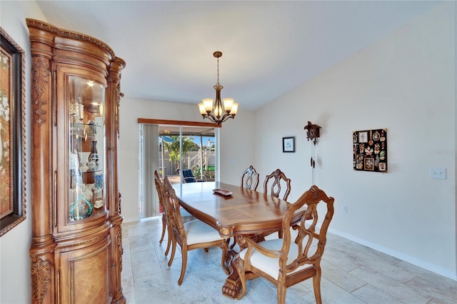 dining space with a notable chandelier