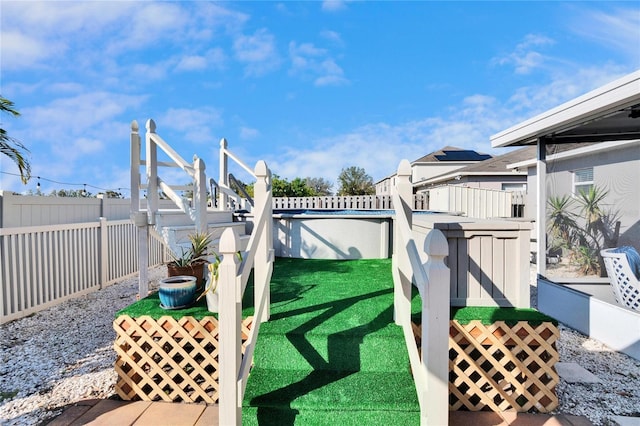 exterior space featuring a fenced in pool