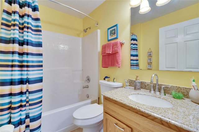 full bathroom with vanity, shower / bath combination with curtain, and toilet