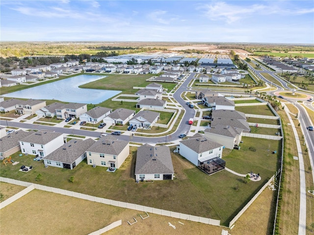 bird's eye view featuring a water view and a residential view