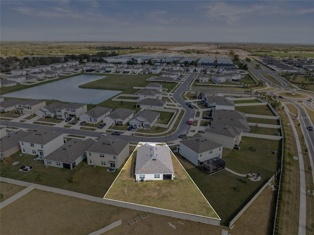 aerial view featuring a water view and a residential view