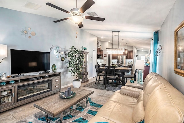 living room with vaulted ceiling and ceiling fan