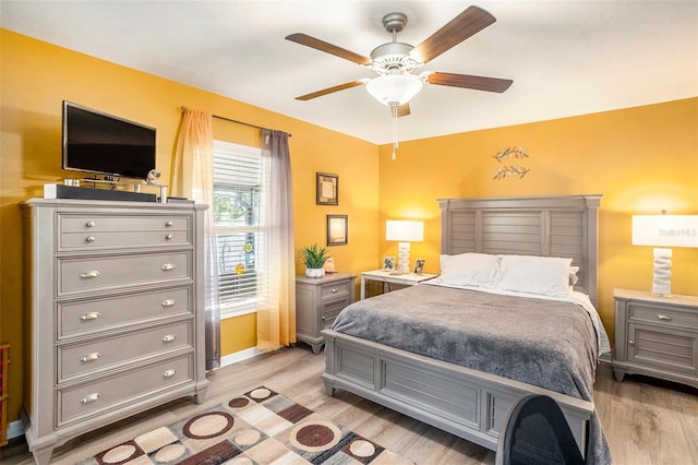 bedroom featuring light hardwood / wood-style flooring and ceiling fan