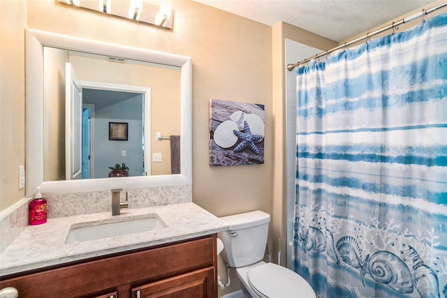 bathroom featuring vanity, a textured ceiling, toilet, and a shower with shower curtain