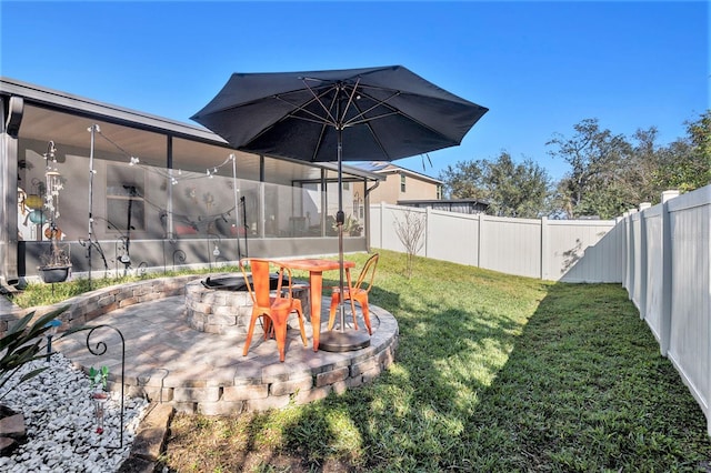 view of yard featuring a patio and a fire pit